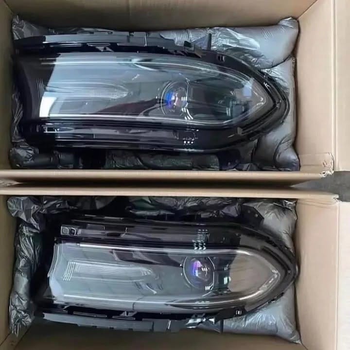 OEM headlights removed from a Dodge Charger - Image 1